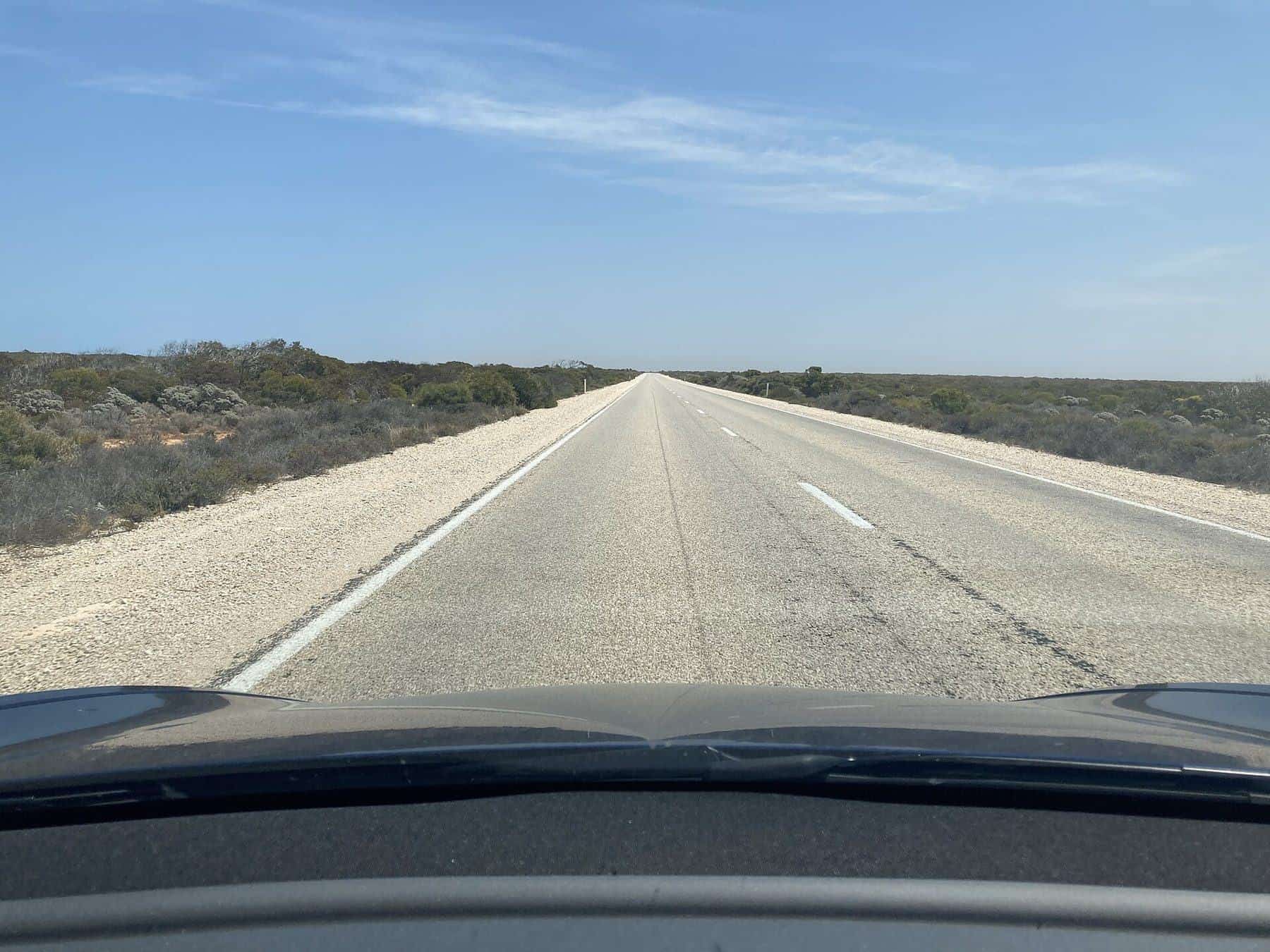 The Eyre Highway running straight across the flat Nullarbor Plain